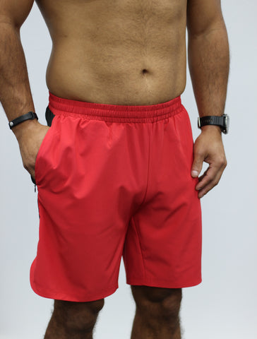 Red men's gym shorts, 7" length, with zipped pockets.