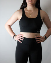 Black sports crop, with stunning back strap feature.