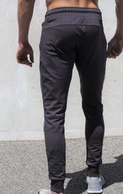 Dark grey track pants, with pockets